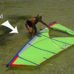 Position the sail, mast toward the wind